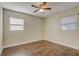 Bedroom with hardwood floors and neutral wall color at 718 Kensington St, Eustis, FL 32726