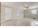 Bright living room featuring tile floors and ceiling fan at 718 Kensington St, Eustis, FL 32726