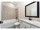 Full bathroom with tiled shower/tub combo and granite vanity top at 7752 Somersworth Dr, Kissimmee, FL 34747