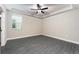 Spacious main bedroom with wood-look flooring and neutral paint at 7752 Somersworth Dr, Kissimmee, FL 34747