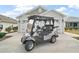 Golf cart parked in driveway at 930 Horton Ter, The Villages, FL 32163