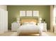 Serene bedroom with natural light, white and wood furniture, and green accents at 3105 Zuni Rd, Saint Cloud, FL 34771