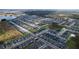 Aerial view of a large residential community with various housing styles and a lake at 4407 Rapallo Ave, Winter Haven, FL 33884