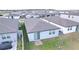 Aerial view showcasing home's backyard and neighborhood at 4407 Rapallo Ave, Winter Haven, FL 33884