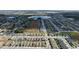 Aerial view of a large residential community with various housing styles and a lake at 4407 Rapallo Ave, Winter Haven, FL 33884