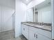 Bright bathroom boasts double vanity, granite countertop, and walk-in shower at 4407 Rapallo Ave, Winter Haven, FL 33884