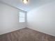 Bedroom with carpet flooring and window with blinds at 4407 Rapallo Ave, Winter Haven, FL 33884