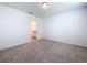 Bright bedroom with carpet and ensuite bathroom access at 4407 Rapallo Ave, Winter Haven, FL 33884