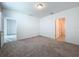 Bright bedroom with carpet and bathroom access at 4407 Rapallo Ave, Winter Haven, FL 33884