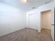 Bright bedroom with plush carpeting and double door closet at 4407 Rapallo Ave, Winter Haven, FL 33884