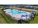 Resort-style pool with ample lounge chairs and shade structures at 4407 Rapallo Ave, Winter Haven, FL 33884