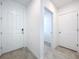 Bright entryway with white doors and tile flooring at 4407 Rapallo Ave, Winter Haven, FL 33884