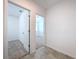 Clean hallway with tile flooring and access to bedrooms at 4407 Rapallo Ave, Winter Haven, FL 33884