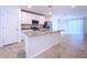 Modern kitchen with white cabinets, granite countertops, and stainless steel appliances at 4407 Rapallo Ave, Winter Haven, FL 33884