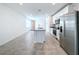 Open concept kitchen featuring stainless steel appliances and granite countertops at 4407 Rapallo Ave, Winter Haven, FL 33884