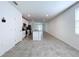 Open concept kitchen with island and gray tile floor at 4407 Rapallo Ave, Winter Haven, FL 33884