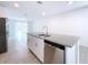 Modern kitchen with stainless steel appliances and granite countertops at 4407 Rapallo Ave, Winter Haven, FL 33884