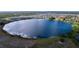 Aerial view of a large lake surrounded by residential community at 4407 Rapallo Ave, Winter Haven, FL 33884