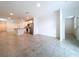 Spacious living room with tile flooring and access to kitchen at 4407 Rapallo Ave, Winter Haven, FL 33884