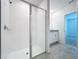 Modern shower with frameless glass enclosure and white tile at 4407 Rapallo Ave, Winter Haven, FL 33884