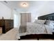 Main bedroom with king-size bed and dresser at 4936 Mainsail Street, Haines City, FL 33844