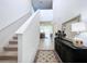 Entryway with staircase, console table, mirror, and rug at 4936 Mainsail Street, Haines City, FL 33844