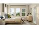 Bright, airy bedroom with large windows, neutral walls, and a wooden bed frame at 7005 Rosy Sky Ave, Orlando, FL 32829