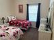 ' bedroom with two twin beds, Minnie Mouse theme, and white wicker furniture at 409 Lucaya Loop # 409, Davenport, FL 33897