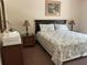 Relaxing bedroom with king-size bed, matching nightstands, and ample natural light at 409 Lucaya Loop # 409, Davenport, FL 33897