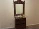 Wicker console table with mirror and decorative accents in hallway at 409 Lucaya Loop # 409, Davenport, FL 33897