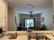 Kitchen pass-through looking into the dining and living areas at 409 Lucaya Loop # 409, Davenport, FL 33897