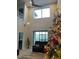 Spacious living room with high ceilings, large windows, and a Christmas tree at 1263 Verdant Glade Pl, Winter Park, FL 32792