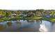 Aerial view of lakefront community with lush landscaping and homes at 1694 Town Park Dr, Port Orange, FL 32129