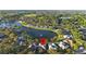 Bird's-eye view of house and community near lake at 1694 Town Park Dr, Port Orange, FL 32129