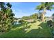 Spacious backyard with lake view and lush landscaping at 1694 Town Park Dr, Port Orange, FL 32129