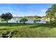Spacious backyard overlooking a tranquil lake at 1694 Town Park Dr, Port Orange, FL 32129