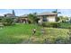 Single-Gathering home with festive lawn decorations and green grass at 1694 Town Park Dr, Port Orange, FL 32129