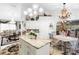 Spacious kitchen with granite island, chandelier, and decorative roosters at 1694 Town Park Dr, Port Orange, FL 32129