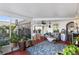 Relaxing screened porch with seating and terracotta tile floor at 1694 Town Park Dr, Port Orange, FL 32129