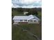 Aerial view of a ranch-style house with a covered porch at 4915 Mount Pleasant Rd, Groveland, FL 34736
