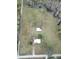 Aerial view of two houses and several outbuildings on a large lot at 4915 Mount Pleasant Rd, Groveland, FL 34736