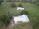 Aerial view of house and detached workshop at 4915 Mount Pleasant Rd, Groveland, FL 34736