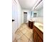 Bathroom with double sinks and tiled shower at 4915 Mount Pleasant Rd, Groveland, FL 34736