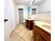 Bathroom with double sinks and tiled floor at 4915 Mount Pleasant Rd, Groveland, FL 34736