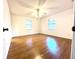 Bedroom with white walls and wood flooring at 4915 Mount Pleasant Rd, Groveland, FL 34736
