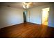 Spacious bedroom with wood floors and access to bathroom at 4915 Mount Pleasant Rd, Groveland, FL 34736