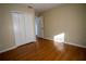 Simple bedroom with wood flooring and double door closet at 4915 Mount Pleasant Rd, Groveland, FL 34736
