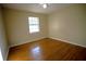 Bedroom with hardwood floors, a ceiling fan, and a window at 4915 Mount Pleasant Rd, Groveland, FL 34736