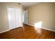 Bright bedroom with hardwood floors and a large closet at 4915 Mount Pleasant Rd, Groveland, FL 34736