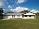 Ranch style home with metal roof, carport and spacious yard at 4915 Mount Pleasant Rd, Groveland, FL 34736